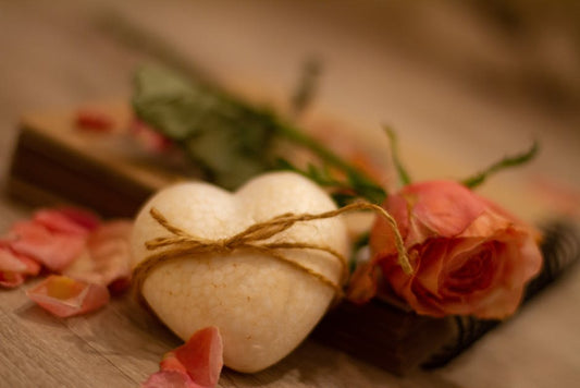 Beautiful heart-shaped soap with pink rose and petals, perfect for Valentine’s Day gifts.